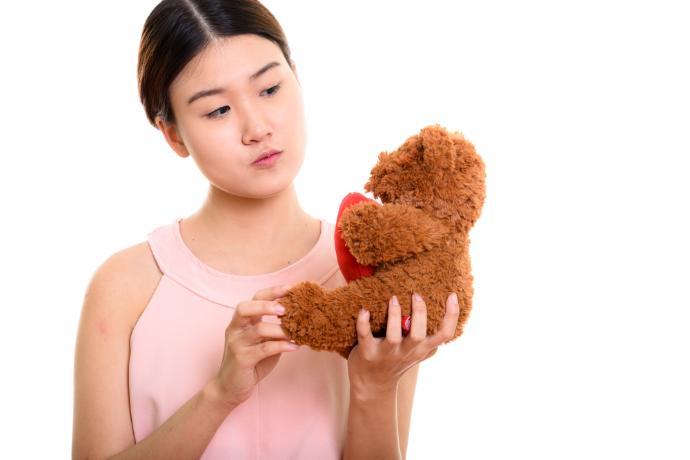 Gift of teddy bear holding giant love heart could honestly mean anything